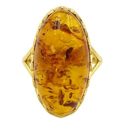 Silver-gilt oval Baltic amber ring, with pierced gallery and shoulders, stamped 925