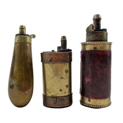 19th century copper and brass powder flask stamped Dixon, together a leather covered and brass powder flask and another with brass body and copper banding, both for Flintlock pistols (3)