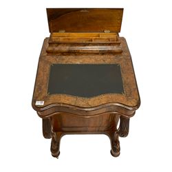 Victorian figured walnut Davenport, lidded sarcophagus shaped pen compartment with fitted interior, desk with inset writing slope enclosing maple lined interior with three drawers, over a bank of four drawers and four matching faux drawers, raised on platform base with cabriole supports carved with acanthus leaves, on casters.