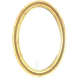 Victorian oval wall mirror in gilt frame with bevelled plate 64cm x 89cm