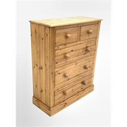 Traditional polished pine chest, fitted with two short and three long drawers, raised on skirted base 