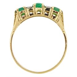 18ct gold three stone oval emerald and four stone diamond ring