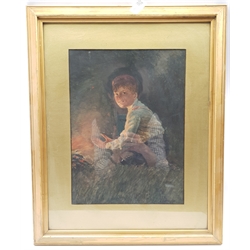 John T Gilroy (British exh.1927-1940): Boy by the Campfire, watercolour signed and dated '14, 37cm x 27cm; and pair 20th century pastel portraits indistinctly signed 38cm x 30cm (3)