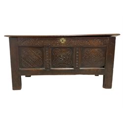 18th century oak coffer or chest, rectangular double hinged top with moulded edge, lunette carved frieze over triple panelled front with foliate and lozenge carvings, on stile feet