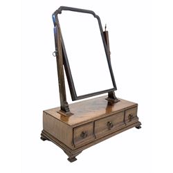 Late 18th century George III mahogany toilet swing mirror, original mercury backed mirror plate in a stepped arch frame raised on fluted uprights with urn finials, three drawers under, raised on ogee bracket supports W51cm