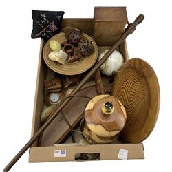 Treen items including a table lamp, carved fuit, plate etc, carved stone eggs and sphere, African walking cane etc in one box