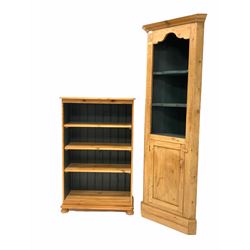 Pine floor standing corner cupboard, with two open shelves over cupboard under, raised on a skirted base (W68cm, H191cm, D43cm) together with a polished pine three tier open bookcase on compressed bun supports (W78cm)