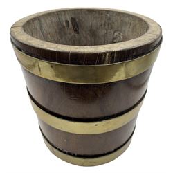 Early 19th century hewn walnut bucket or jardiniere, with three brass bands, lacking liner and base, H22cm x D22cm 
