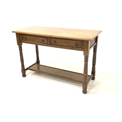 Solid oak serving table, lunette carved frieze fitted with two drawers, raised on turned supports united by stretcher 