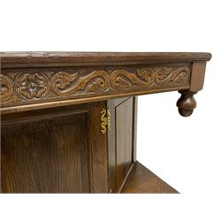 19th century oak court cupboard, the projecting top carved with foliate s-scrolls, canted cupboard with panelled door and sides, fitted with two drawers and two panelled cupboards with walnut banding, on bracket feet