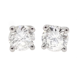 Pair of 18ct white gold diamond stud earrings, stamped 750, total diamond weight 1.05 carat, with World Gemological Certificate