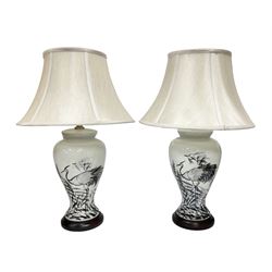 Pair of table lamps of tapering form, decorated with herons wading amongst reeds, on a white ground, with a circular footed base, including shades H66cm 