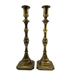 Pair of tall 19th century brass candlesticks with baluster stems and square bases H43cm