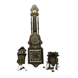 Two Bavarian cuckoo clocks and a modern barometer with clock and thermometer