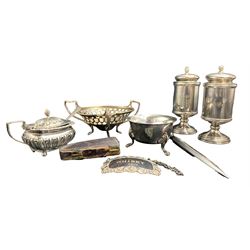 Pair of silver cylindrical pedestal condiments with inscriptions H11cm Birmingham 1978, silver rectangular salt, circular salt, small sweetmeat dish, decanter label, silver handled paper knife and a silver and amber cheroot holder, weighable silver 10oz