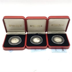 Queen Elizabeth II 1997, 1998 and 1999 Isle of Man silver proof Christmas fifty pence coins, all cased with certificates