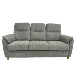 G-Plan - three seat sofa upholstered in grey fabric, raised on turned supports 