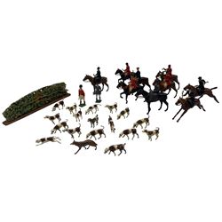 Collection of Britains lead hunting figures including nine on horseback, two standing, seventeen hounds and a fox, 29 pieces