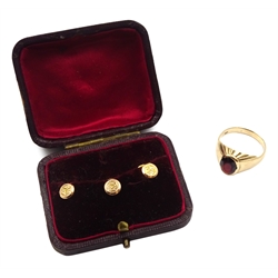 Gold garnet signet ring stamped 9ct and three Victorian gold shirt studs, Birmingham 1898, in silk and velvet lined box
