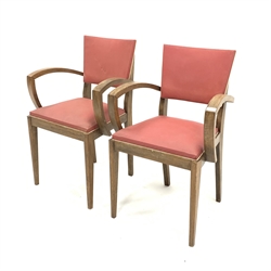 Pair of 1930s French Art Deco open armchairs, with back and seat upholstered in red faux leather, bentwood arms, raised on square tapered supports, W52cm