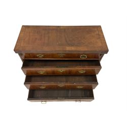 George III walnut bachelors chest, the crossbanded rectangular fold over top with baize inset supported by two slide out stays, the inset lifting to reveal secret compartment with fitted interior, the main chest fitted with three graduating oak lined drawers, each with crossbanding and brass handle pulls, raised on bracket feet