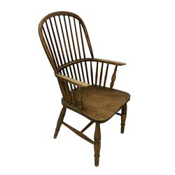 19th century elm and ash Windsor chair, high hoop and stick back over shaped saddle seat, raised on ring turned supports united by H-stretcher