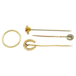 Two Victorian gold horseshoe stick pins, gold seed pearl knot stick pin and an 18ct gold wedding band, hallmarked