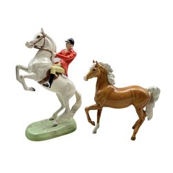 Beswick Huntsman on white painted rearing horse no.868 H25cm (a/f) together with a Beswick Palomino horse (2)