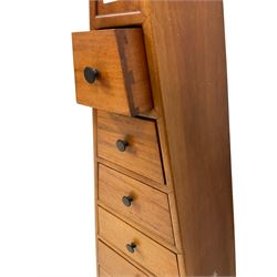 Hardwood pyramid chest, fitted with nine drawers