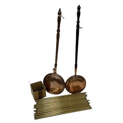 Two 19th century copper warming pans together with a set of fourteen brass stair rods with clips