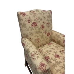 Peter Dudgeon - Georgian design mahogany framed armchair, shaped cresting rail over sprung back and seat flanked by rolled arms, upholstered in floral patterned fabric with matching seat cushion, on square supports joined by stretchers
Provenance: From the Estate of the late Dowager Lady St Oswald