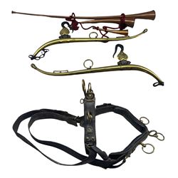 Three copper post horns, pair of leather horse harnesses with brass mounts and a pair of brass horse hames 