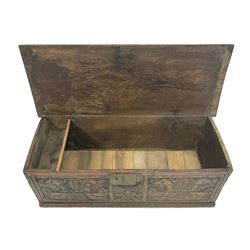 18th century oak coffer or chest, rectangular hinged top with moulded edge, fitted with candle box, the front carved with stylised plant motifs, raised on stile supports