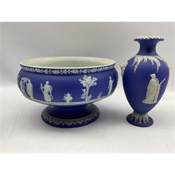 Group of late 19th/20th century Wedgwood dark blue jasper dip items comprising pedestal fruit bowl D20cm, biscuit barrel and cover, hot water jug with metal cover and a baluster vase H18cm (4)
