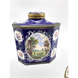Late 18th century Bilston enamel octagonal tea caddy, the blue ground decorated with Rococo style white enamel cartouches containing landscape scenes with figures and animals together with a pair of matching candlesticks, H27cm 