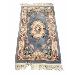 Chinese washed wool ground rug with floral design enclosed by a floral boarder (176cm x 91cm)