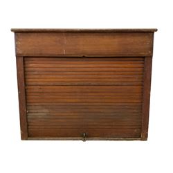 19th century oak hotel or post office pigeonhole cabinet, rectangular walnut top over twenty four pigeonholes enclosed by pitch pine tambour roll door
Provenance: from the property of the old Ambassador Hotel York
