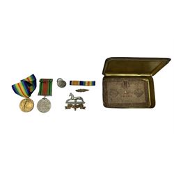 WWI Princess Mary gift tin containing WWI pair of War and Victory medals to 29313 Pte. R Burnell, West Yorkshire Regt., WWII Defence medal, West Yorkshire badge etc
