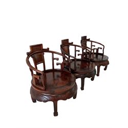 Rosewood circular table and three tub chairs, with burr wood back panels, raised on square tapering supports 