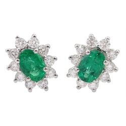 Pair of 18ct white gold oval emerald round brilliant cut diamond stud earrings, stamped 18K, total diamond weight approx 0.55 carat, total emerald weight approx 1.10 carat