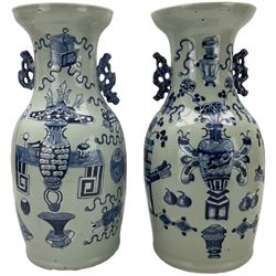 Pair of 18th/ 19th century Chinese twin-handled baluster vases, each painted in underglaze blue with precious objects against a pale celadon ground and pierced blue glaze handles, H42cm 