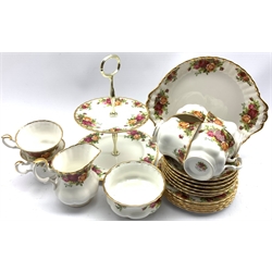Royal Albert Old Country Roses pattern tea set comprising six cups and saucers, six plates, milk jug, sugar bowl, bread and butter plate and a two tier cake stand (22)