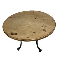 Circular kitchen table, waxed pine top, raised on painted cast iron Britannia style base, the cabriole supports pierced and decorated with scrolls and acanthus leaves, united by undertier 