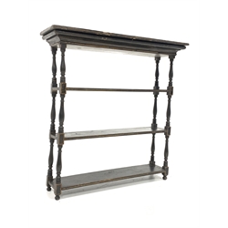 Mid 19th century ebonised and gilt painted three tier wall shelf, with moulded cornice and turned spindle supports 