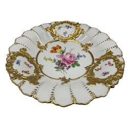 20th century Meissen relief decorated plate, centrally hand painted with floral sprays, with a gilt raised border reserving painted floral panels, impressed no. 152 D30cm