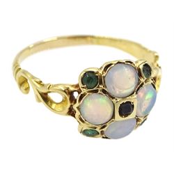 19th century gold opal and stone set circular cluster ring, set with four opal cabochons and circular-cut green and brown stones, with scroll open work shoulders