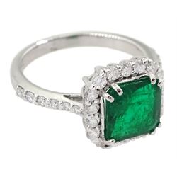 18ct white gold octagonal cut emerald and round brilliant cut diamond cluster ring, with diamond set shoulders, stamped 18K, total diamond weight approx 0.50 carat, emerald approx 1.90 carat