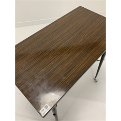Mid 20th century occasional table, with walnut effect laminate top raised on black coated aluminium supports and castors, W75cm