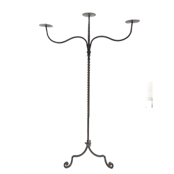 Wrought iron three branch floor standing candelabra, with twisted column on tripod base, H125cm