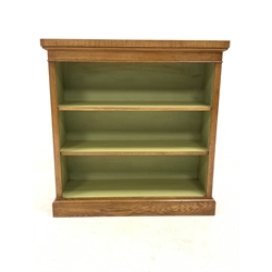 Figured oak open bookcase, cross banded and inlaid top over two adjustable shelves, plinth base, W96cm, H99cm, D30cm